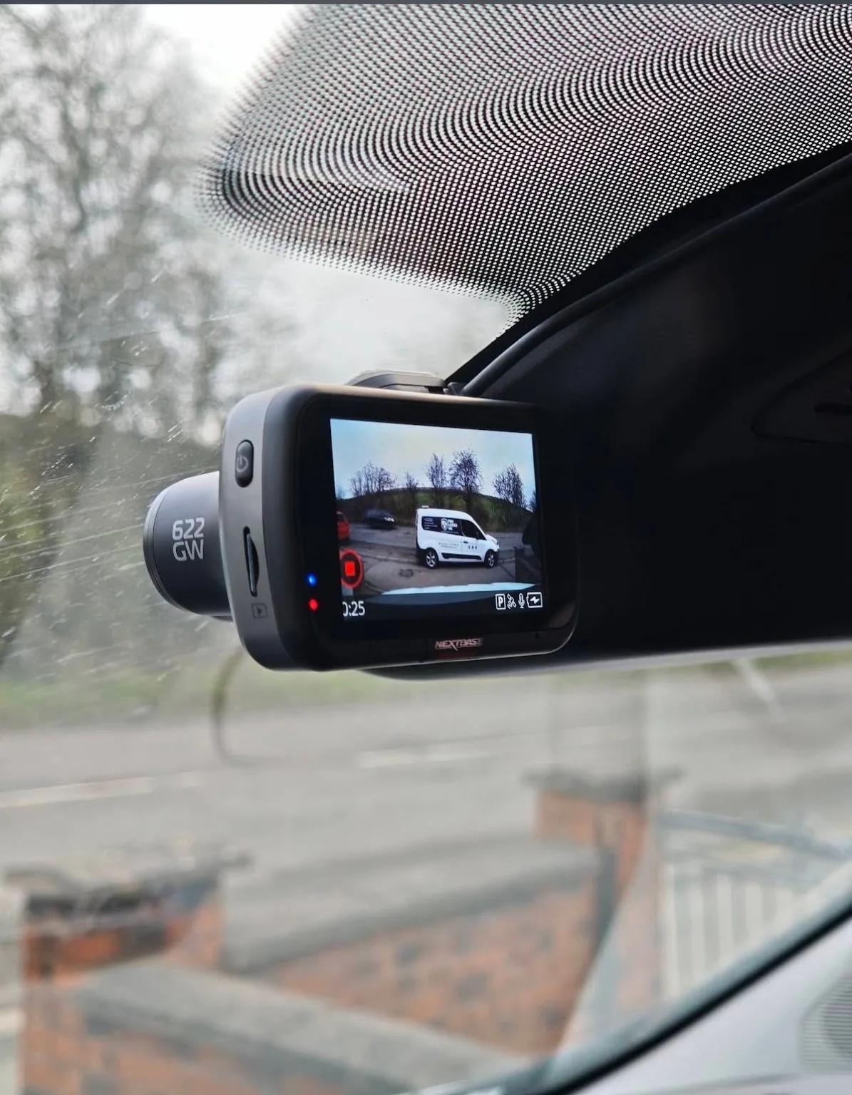 Nextbase dash camera installed at the top of a windscreen