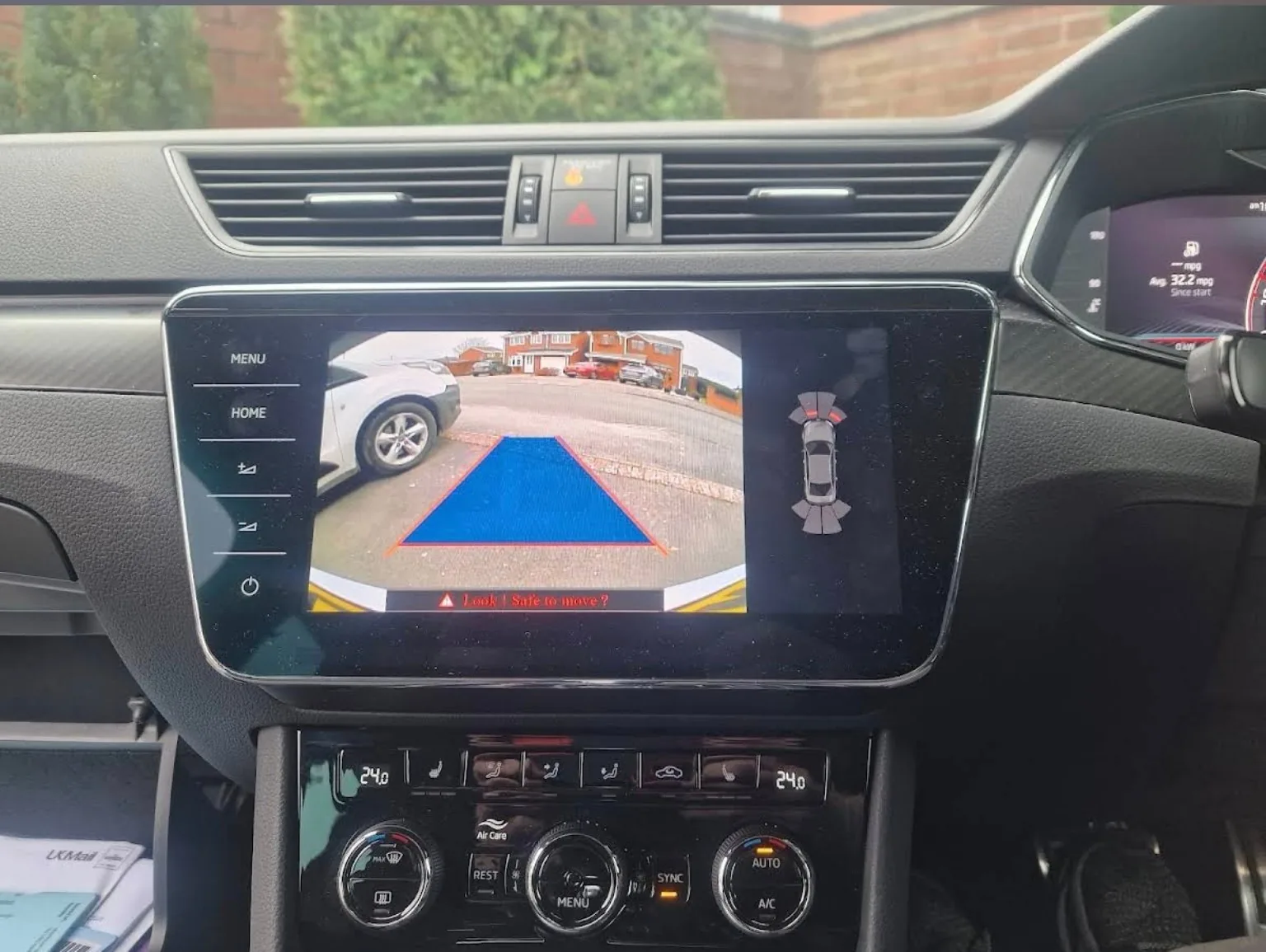 Reverse camera image displayed on a factory infotainment screen