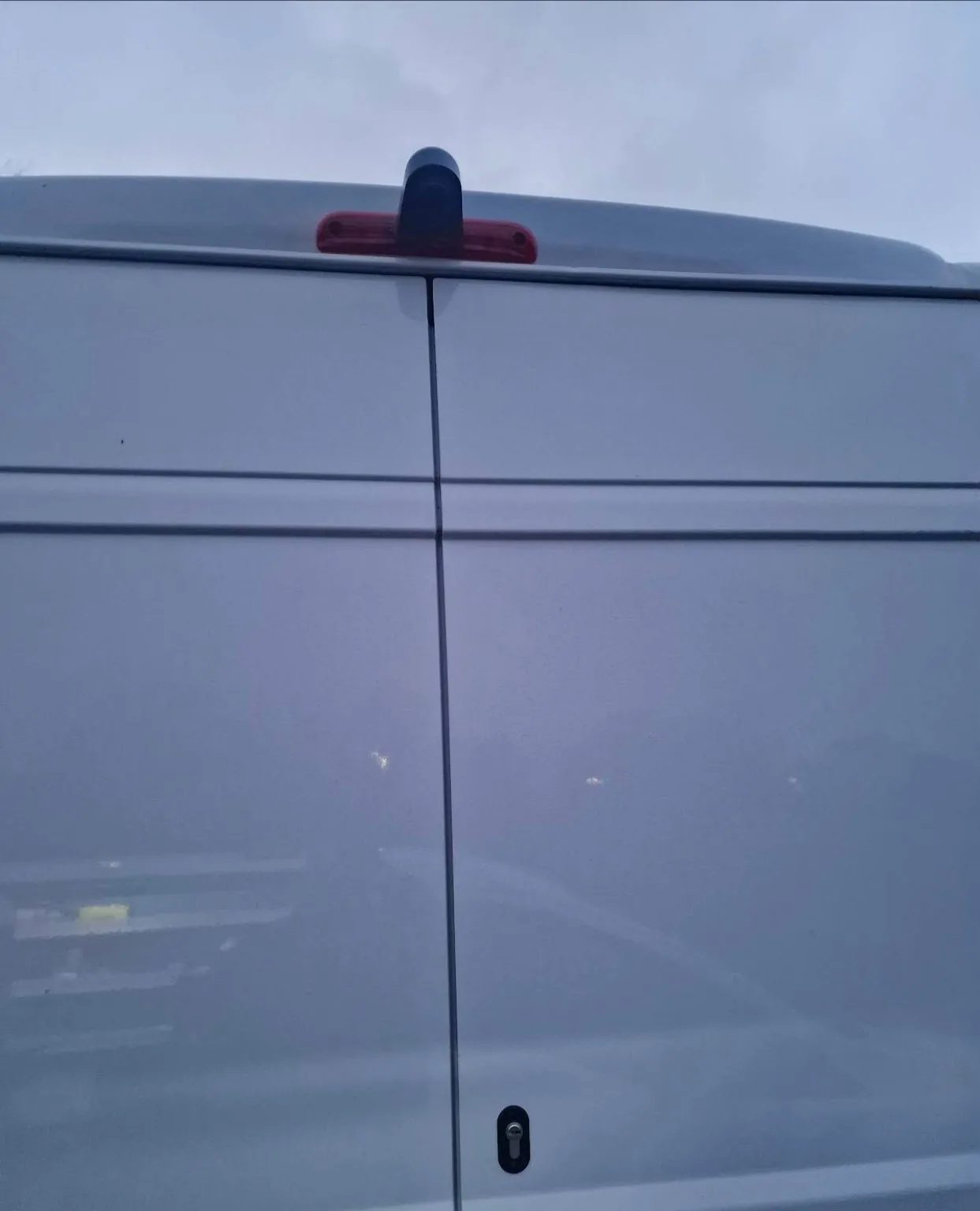 External van deadlock cylinder fitted beside a sliding door handle