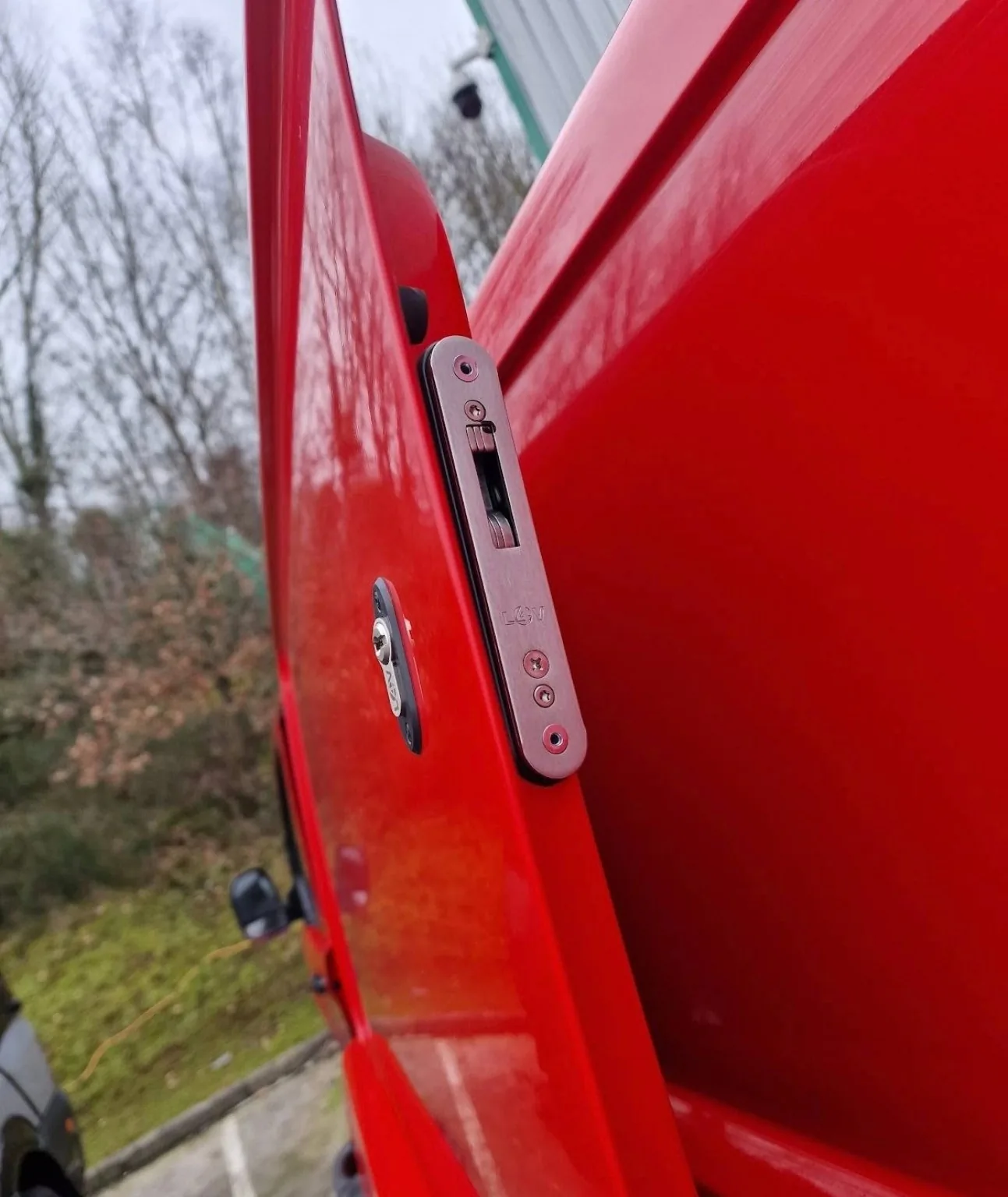 High-security van deadlock fitted into a red commercial vehicle door